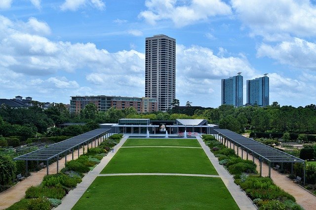 Houston boasts outdoor space even in downtown areas.  This is Hermann Park Conservatory where people love to hang around and picnic.